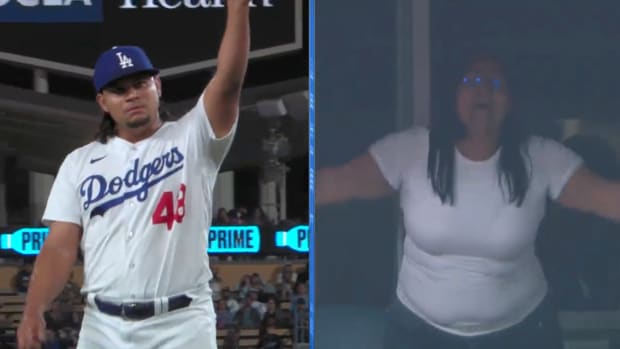 Brusdar Graterol points at his mom in the stands
